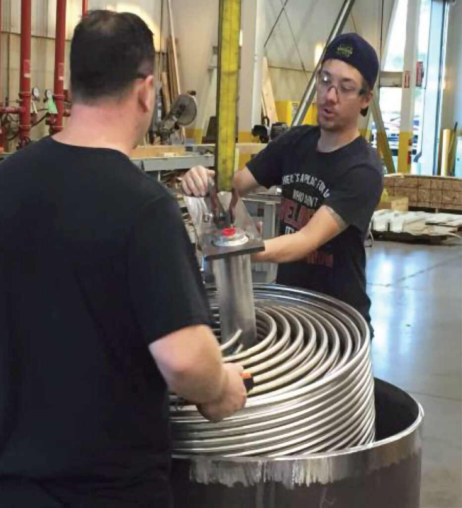 people working on letdown coolers