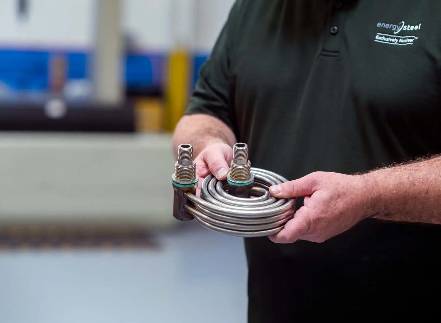 worker holding heat exchanger extended